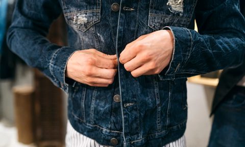 best jackets under 200 man trying on new denim jacket