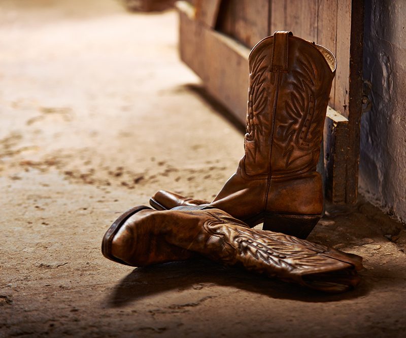 Cowboy boots near a wall