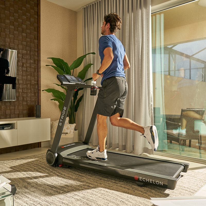 Man running on Eschelon Stride treadmill.