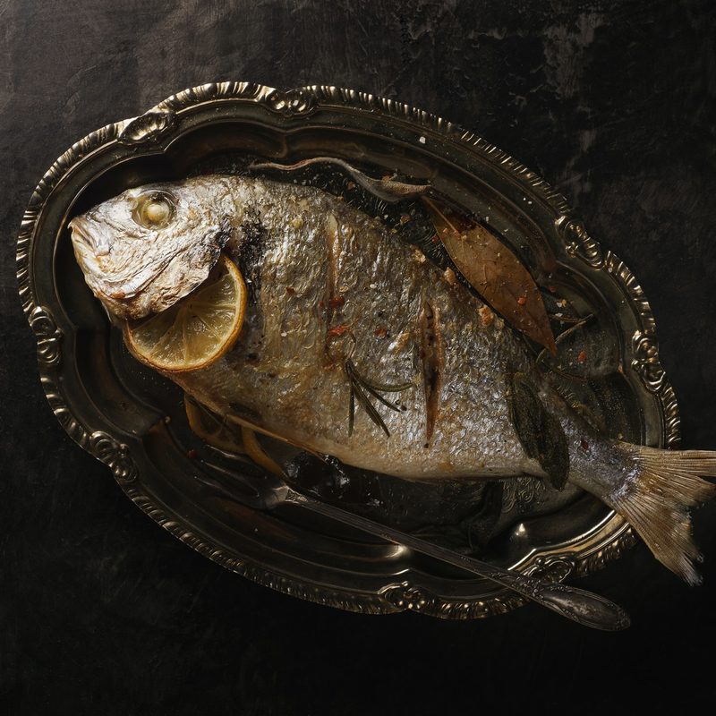 A whole-roasted fish on a plate