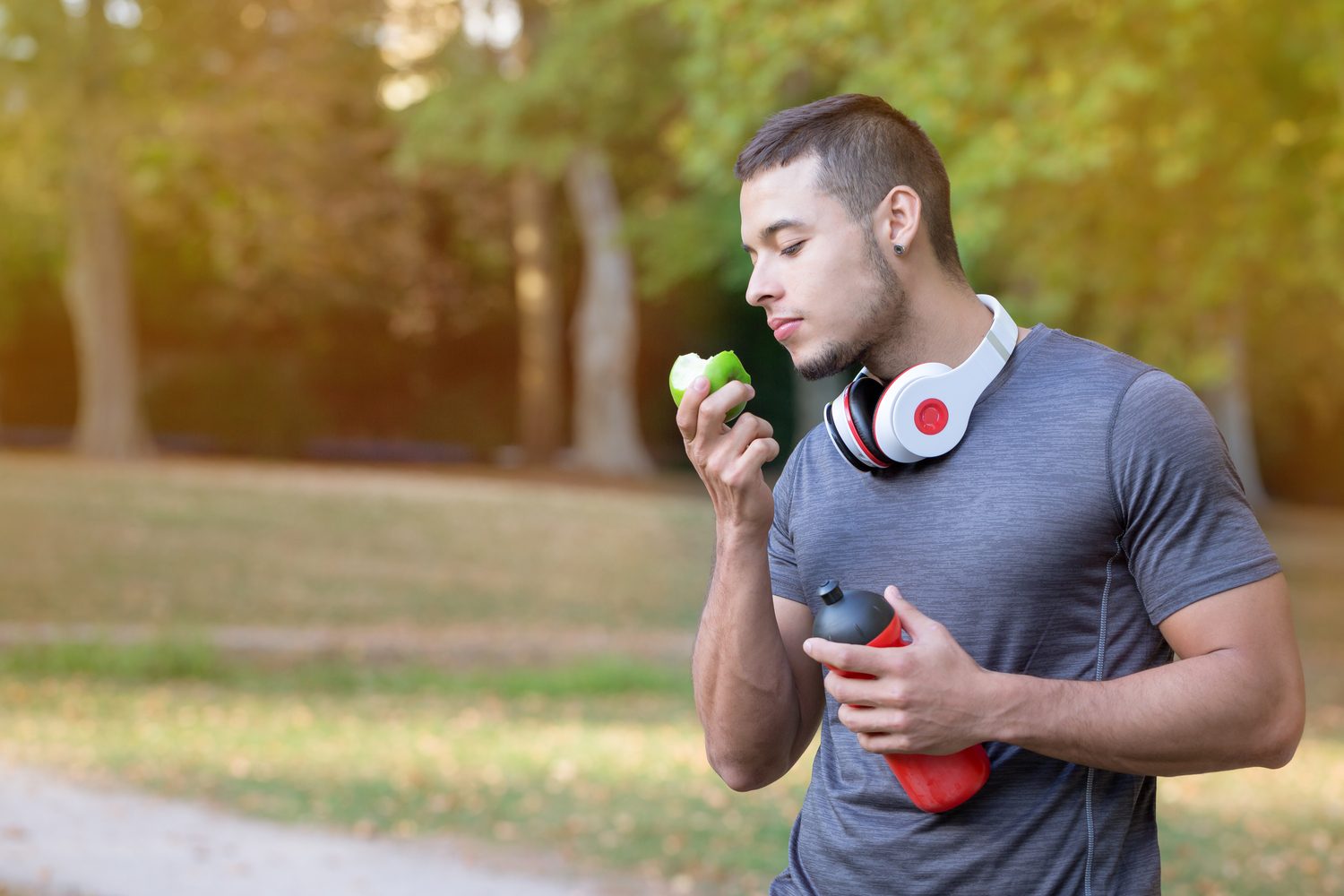 Man eating an apple.