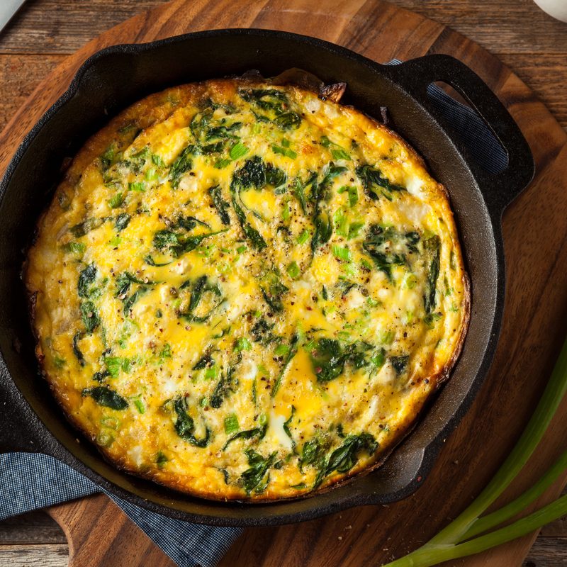 Homemade spinach and feta fritatta in a skillet