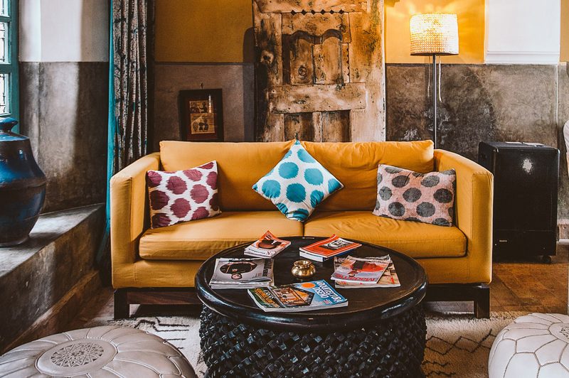 Yellow sofa example of global interior design style