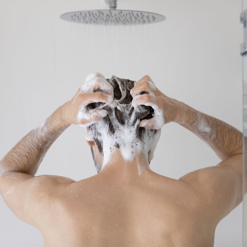Man shampooing his hair