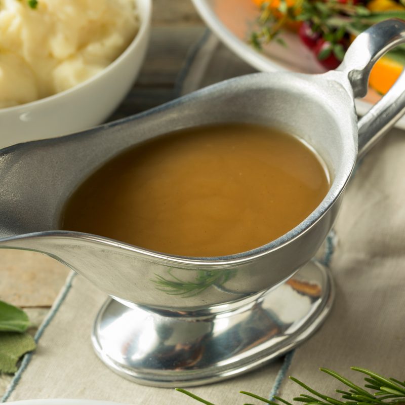 Hot brown organic turkey gravy in a boat
