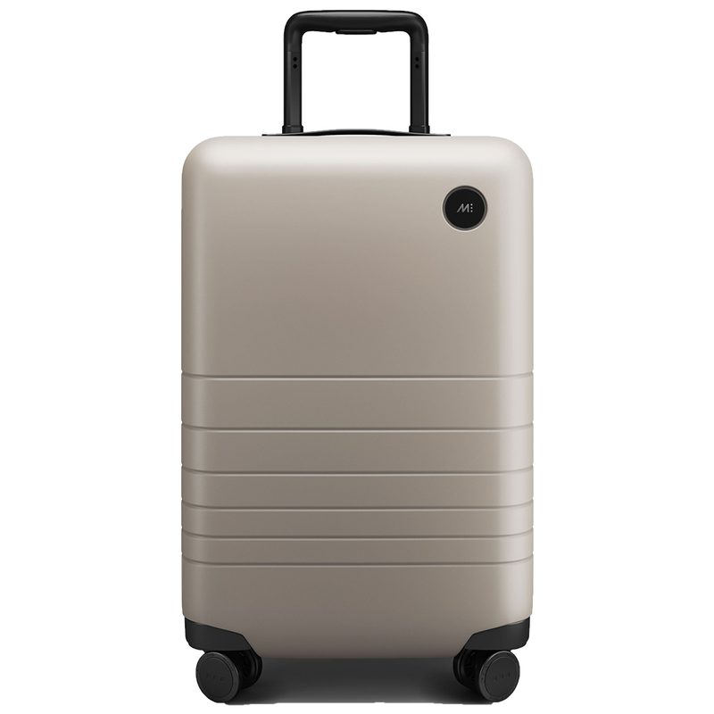 Monos Carry-On Luggage on a white studio background.