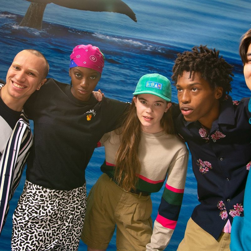 Group of people wearing Noah taking a selfie