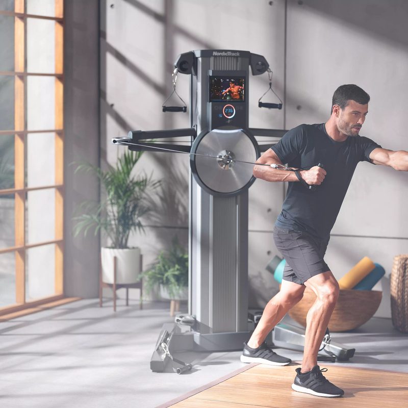 Man working out with cables
