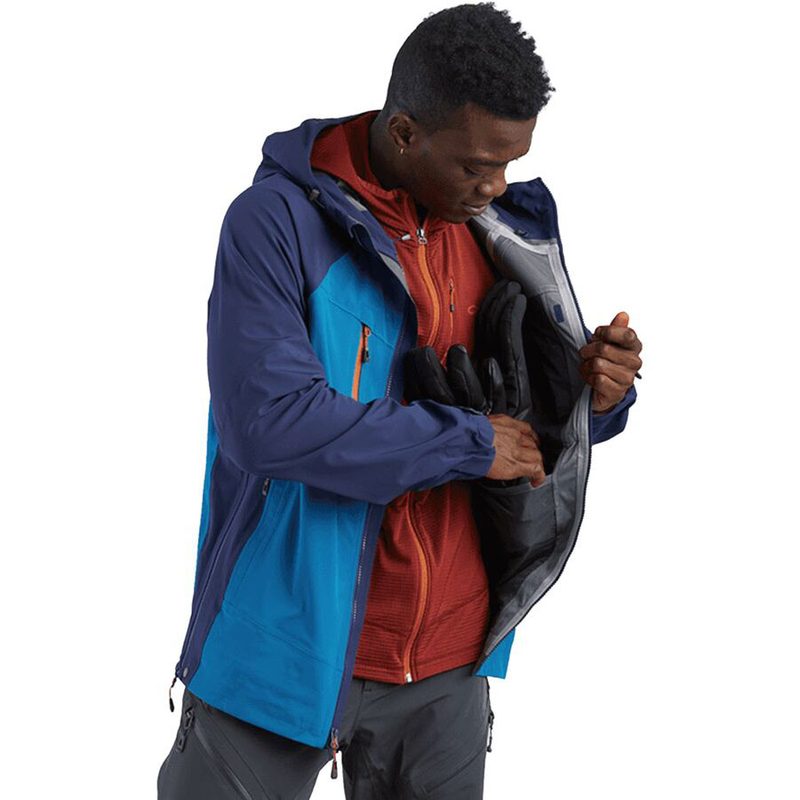 Man in an Outdoor Research Skyward II Jacket on a plain white studio background.