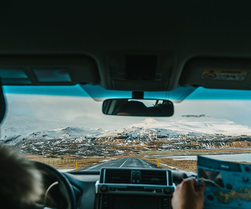 Interior view of man driving car.