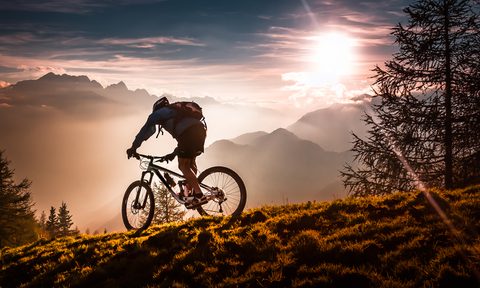 mountain biking guide a biker bikini at sunset