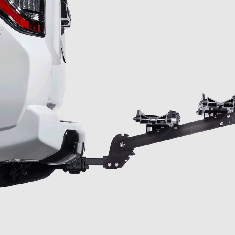 1UP USA Equip-D Double Hitch-Mounted Bike Rack mounted on a vehicle against a plain studio background.