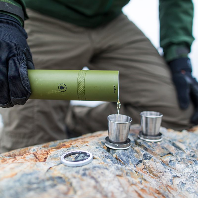 Man pouring liquor from a flask