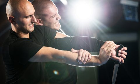 Practicing self-defense with a weapon