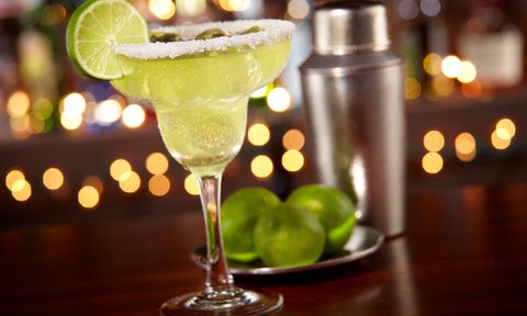 A served margarita sitting on a bar