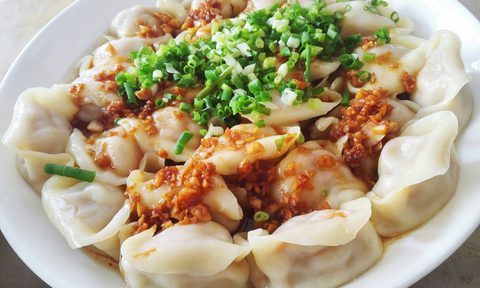 what to eat chinese new year close up of fresh jiaozi served in plate