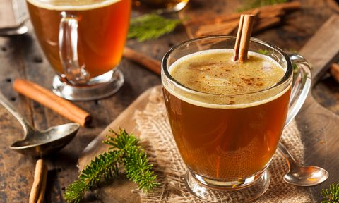 A hot buttered rum with cinnamon stick.