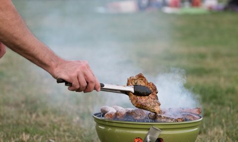Person smoking meat