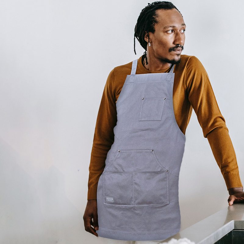 Man wearing cooking apron.