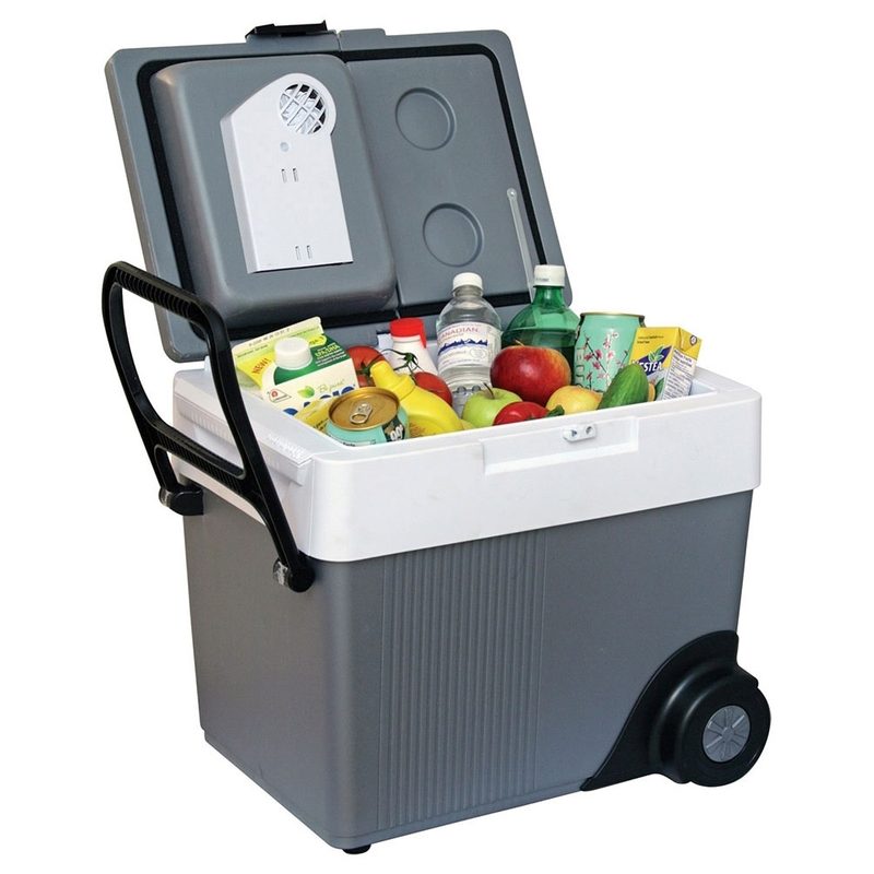A Koolatron Kargo Wheeler Electric Wheeled Cooler containing assorted food and beverages.