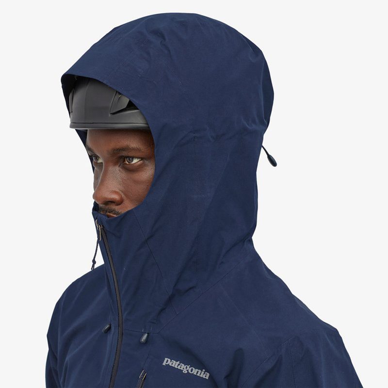 Blue rain gear worn by a model.