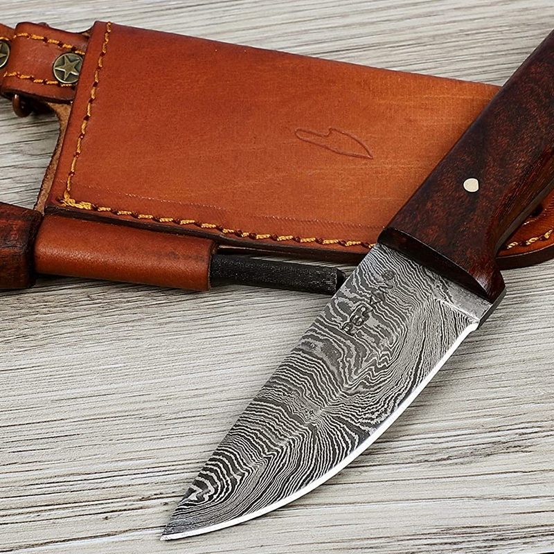 Perkin Custom Handmade Damascus Hunting Knife and a sheath on a wood surface.