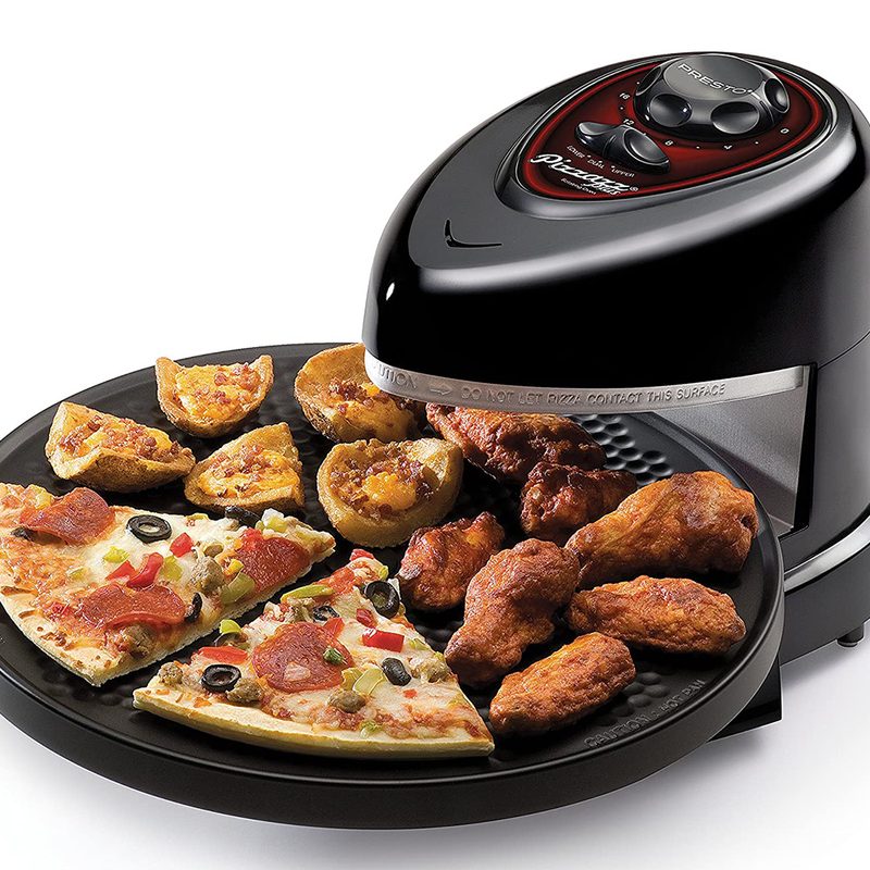 Rotating pizza oven on a white background.