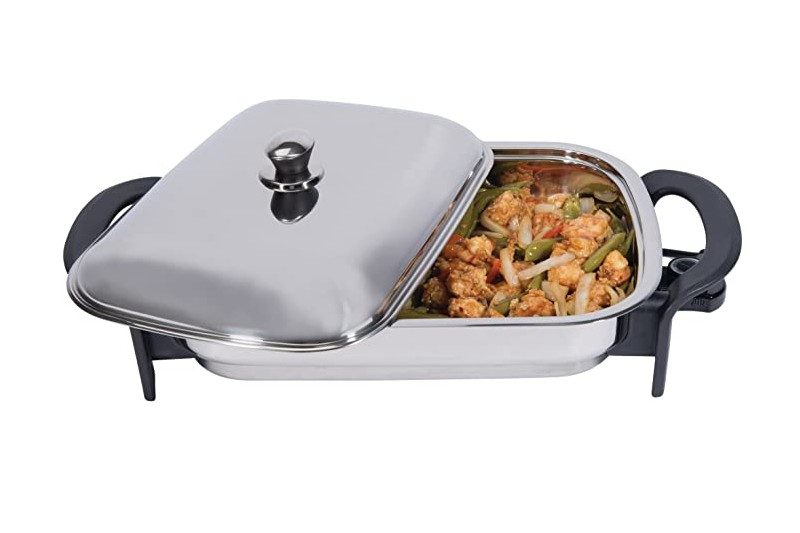 Precise Heat Stainless Steel 16-Inch Rectangular Surgical Electric Skillet with food inside.