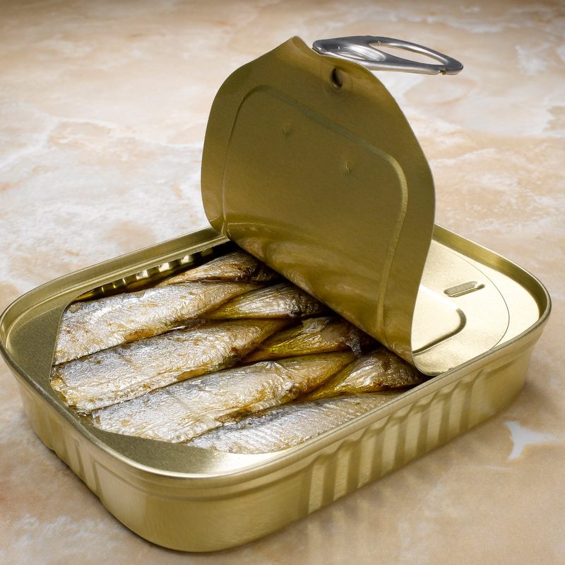 An opened tin of sardines