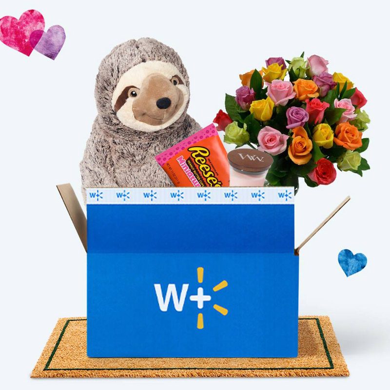 Walmart with Walmart+ valentine's day box with sloth plush and flowers.