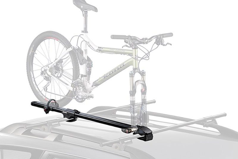 Yakima Universal ForkLift Roof-Mounted Bike Rack mounted on vehicle against a plain studio background.