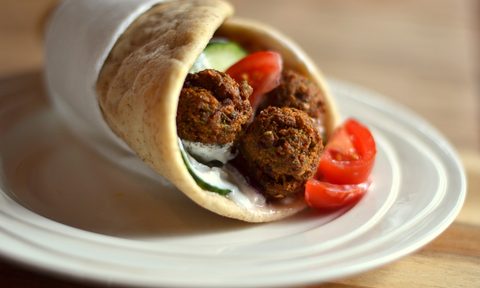 how to make falafel close up of falafels in wrap sandwich on plate