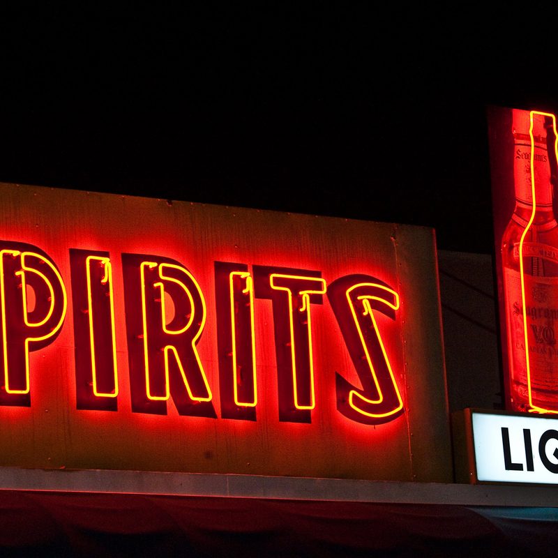 Spirits neon sign on top of a liquor store.