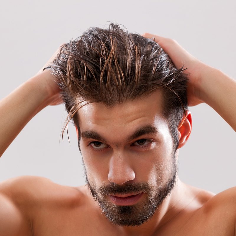 Man putting gel in his hair