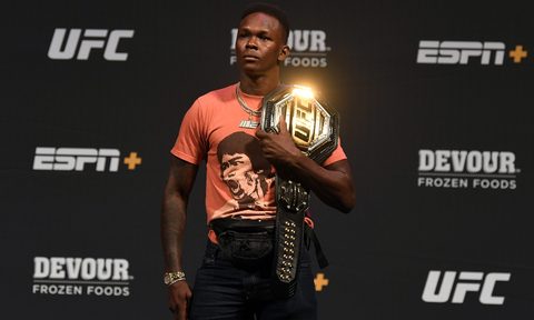 Israel Adesanya at a press conference for a UFC event.