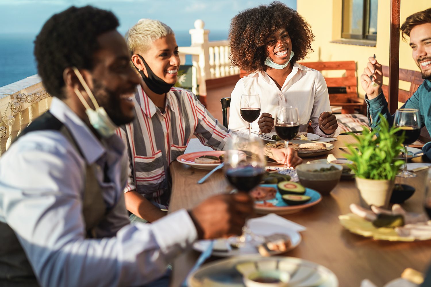 Friends gathered around a table eating