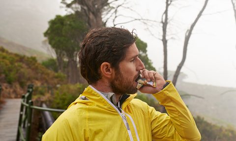 Man eating a hiking snack
