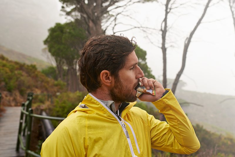 Man eating a hiking snack