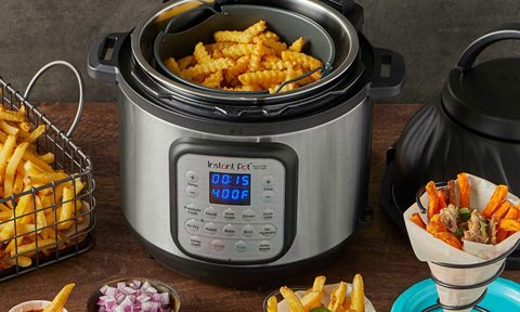 Instant Pot Duo Crisp with prepared foods on counter.