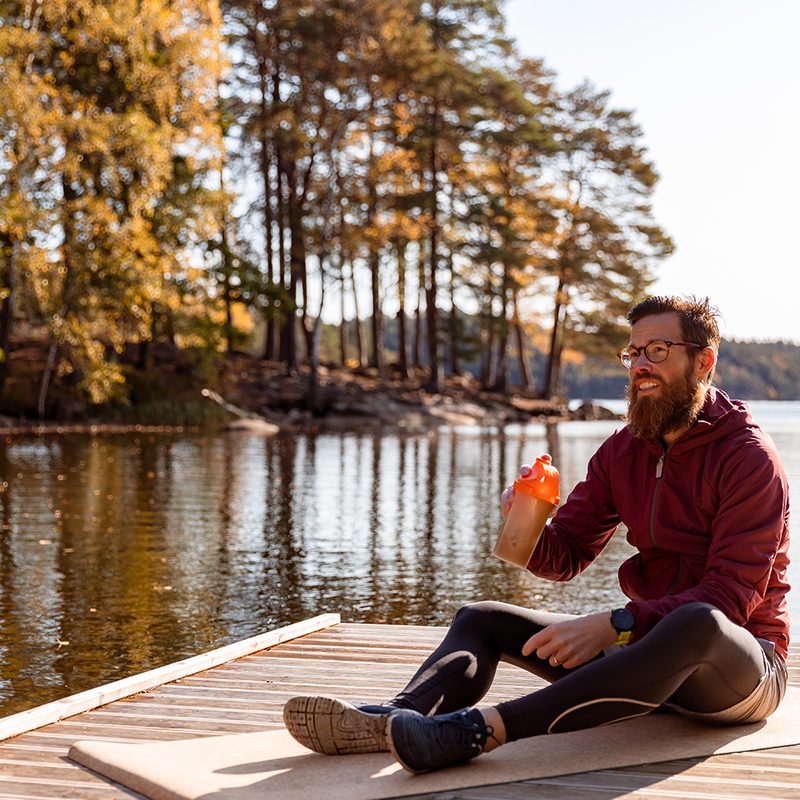 Man drinking after workout outside