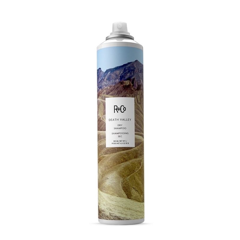 A can of R+Co Death Valley Dry Shampoo on a white background.
