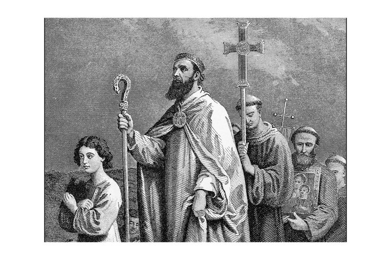 St. Patrick walking with his followers.