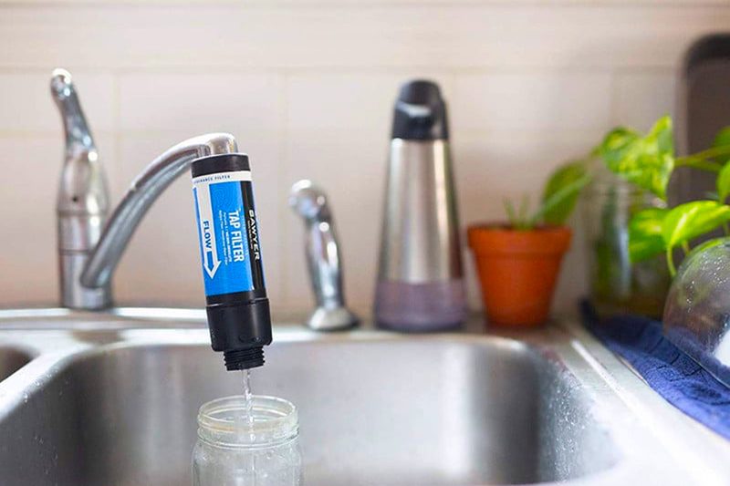 Sawyer Products SP134 TAP Water Filtration System attached to a tap.