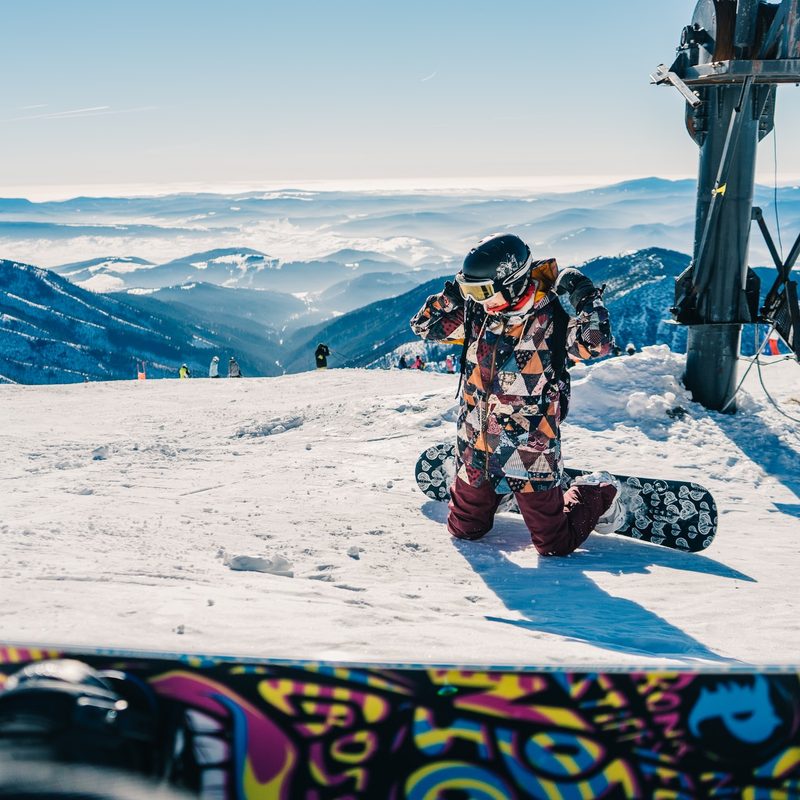 Snowboarder kneeling
