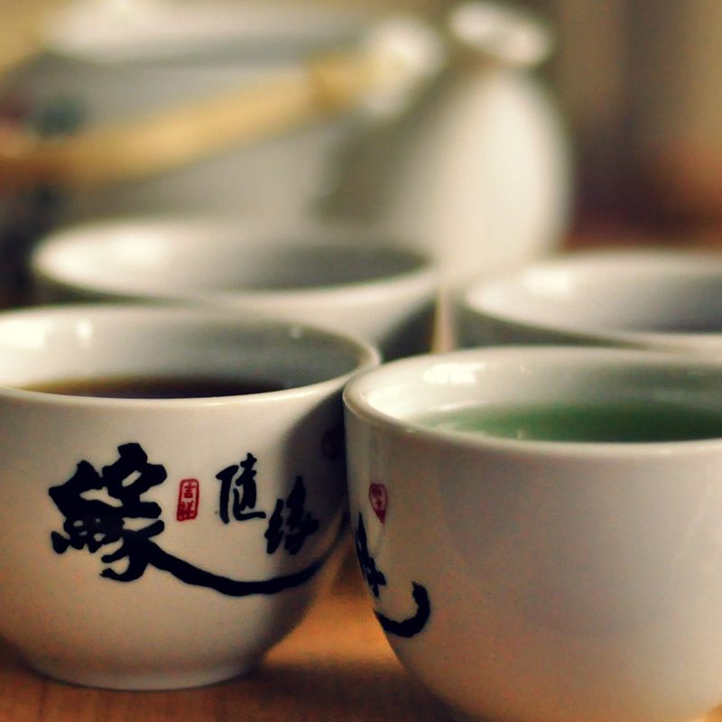 white tea cups served with hot tea.