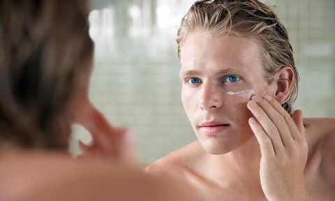 how wear camera friendly makeup man applying facial cream