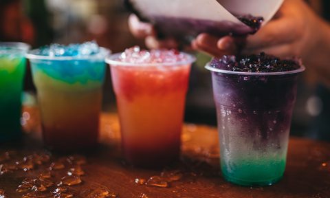A lineup of frozen drinks.