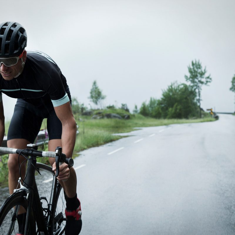man cyclist driving up a mountain road