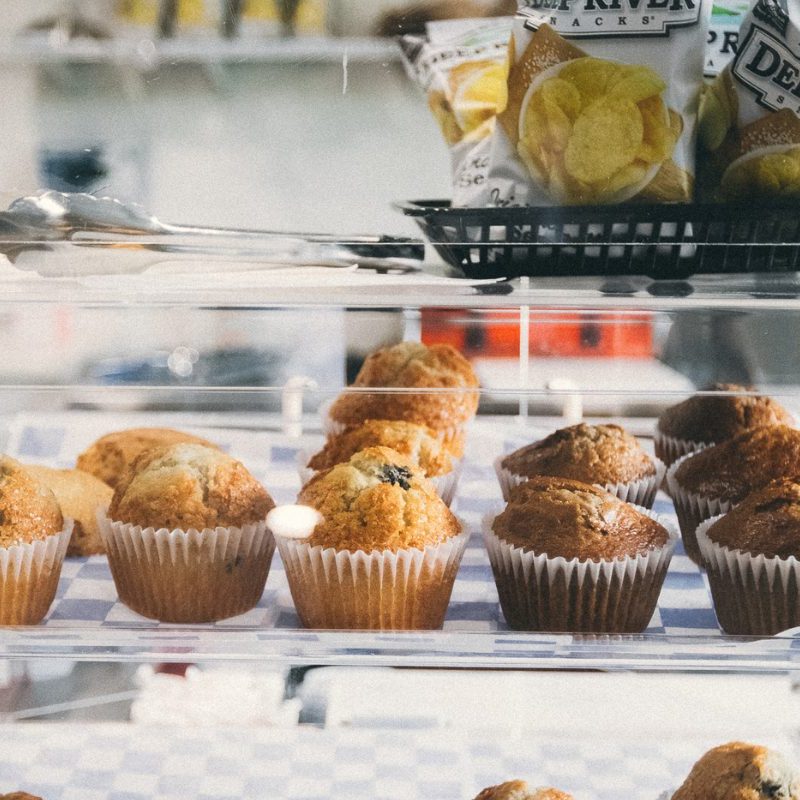 A tray of delicious pastries and bags of chips