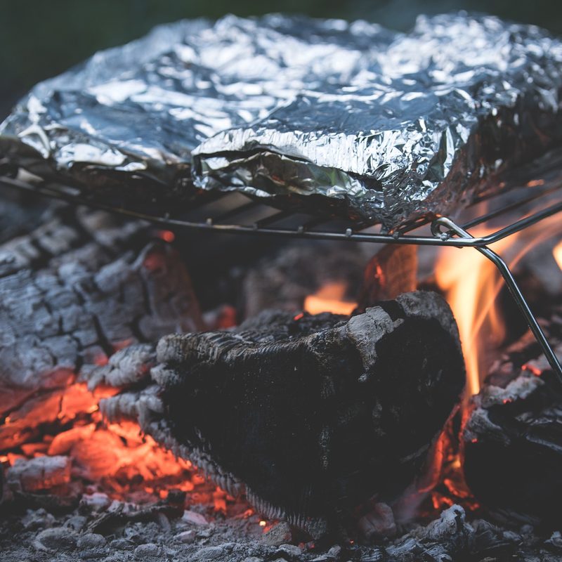 Campfire with grill grate over it